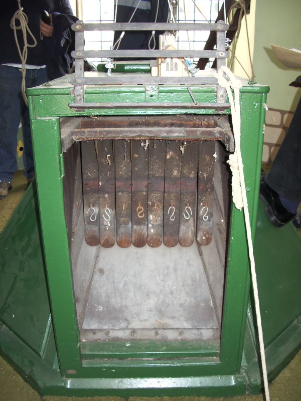 Kingman chiming keyboard (out of use, and since removed into storage) in the centre of the Ringing Room at Christ Church, Walcot in Bath.